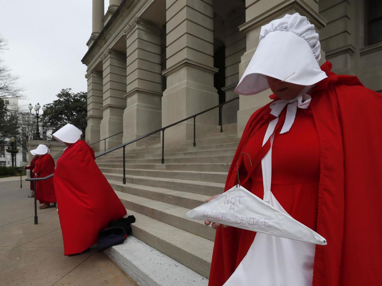 Georgia members of the Handmaid Coalition protest the passage of the 'fetal heartbeat bill' banning abortions after six weeks on International Women's Day, 2019: AP