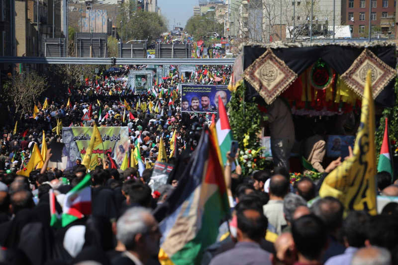 Iranians attend the funeral ceremony of seven members of the Islamic Revolutionary Guard Corps (IRGC) who were killed in an airstrike in Syria, in Tehran. Rouzbeh Fouladi/ZUMA Press Wire/dpa