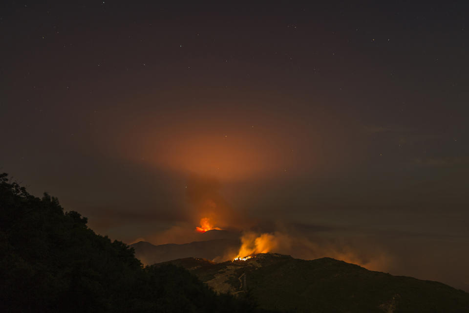 <p>The Whittier Fire burns through the night on July 9, 2017 near Santa Barbara, California. (David McNew/Getty Images) </p>