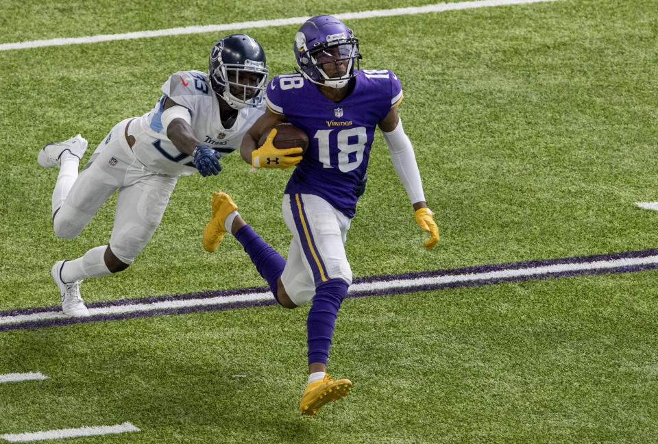 Minnesota Vikings receiver Justin Jefferson (18) runs after a 71-yard touchdown catch during the third quarter of an NFL football game, Sunday, Sept. 27, 2020 in Minneapolis. (Carlos Gonzalez/Star Tribune via AP)