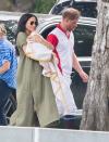 <p>Harry walks with Meghan and Archie after playing in a polo match in Wokingham, England. </p>