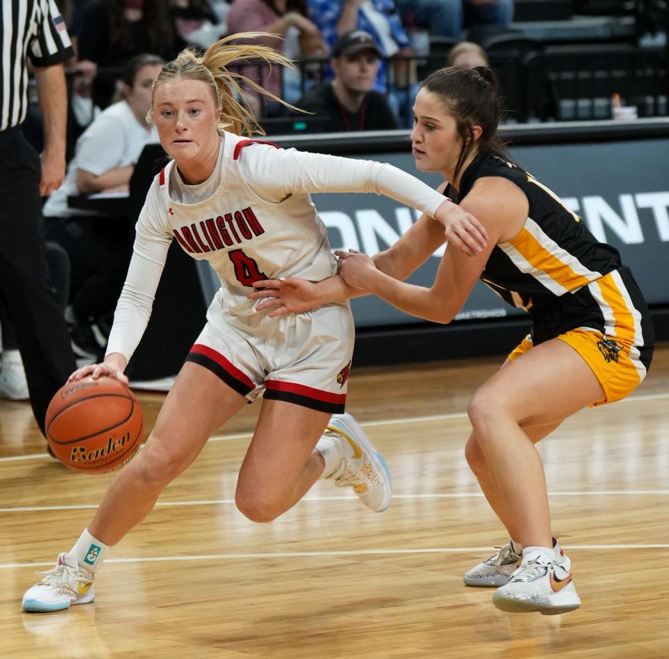 Arlington's Harley Johnson drives past James Valley Christian's Andree Frandsen during their first-round game in the state Class B girls baskeball tournament on Thursday, March 7, 2024 in the Summit Arena at The Monument in Rapid City.