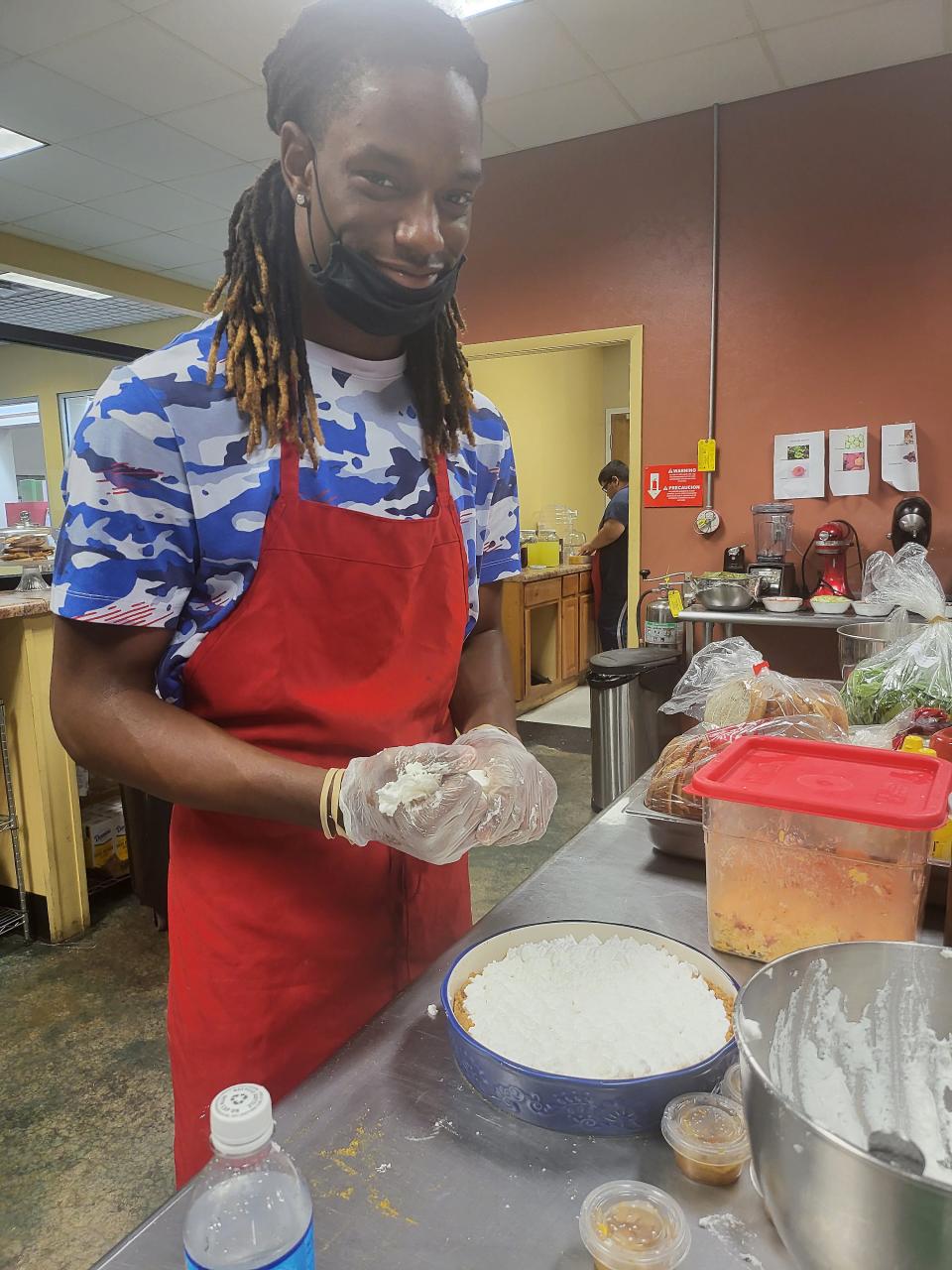 Chris Underwood works in the kitchen at Beautiful Rainbow Cafè.