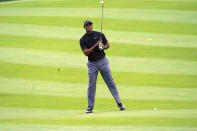 Tiger Woods measures his shot on the 11th fairway during the first round of the Zozo Championship golf tournament Thursday, Oct. 22, 2020, in Thousand Oaks, Calif. (AP Photo/Marcio Jose Sanchez)