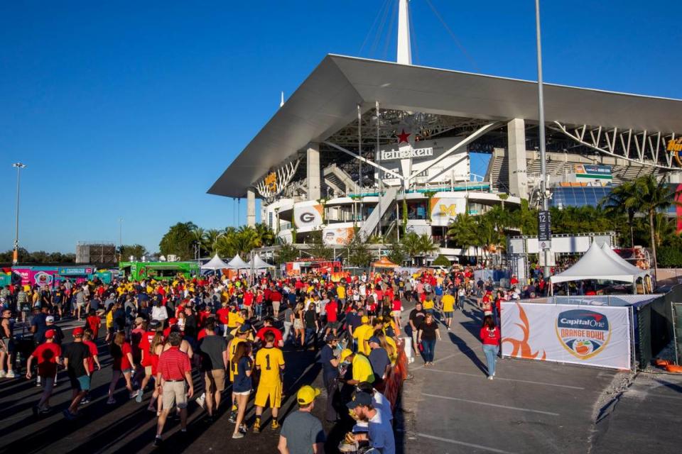 University of Michigan and University of Georgia fans tailgate before kick-off for the 2021 College Football Playoff Semifinal at the Capital One Orange Bowl hosted at Hard Rock Stadium in Miami Gardens, Florida, on Friday, December 31, 2021.