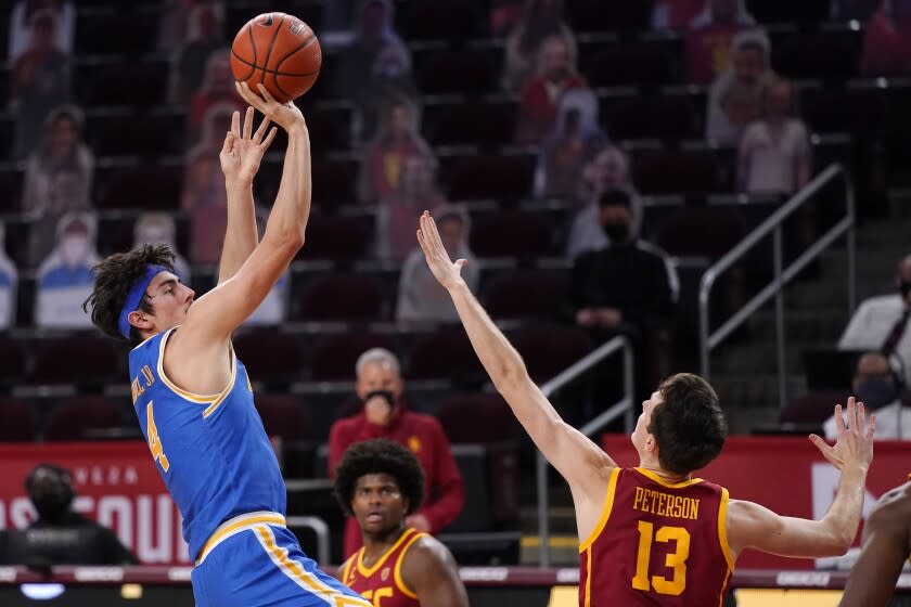 UCLA's Jaime Jaquez Jr. shoots over USC's Drew Peterson during a game Feb. 6, 2021.