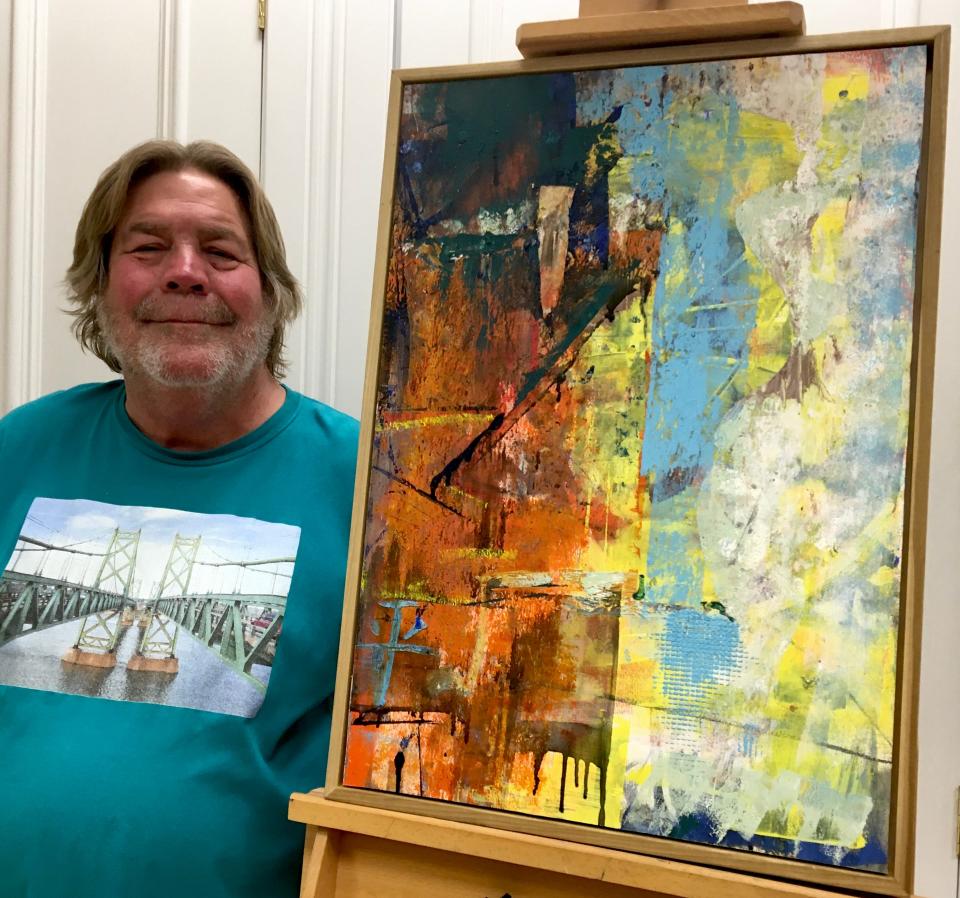Annawan artist Kent Broadbent poses with his painting , “The Sixties Show, Part II