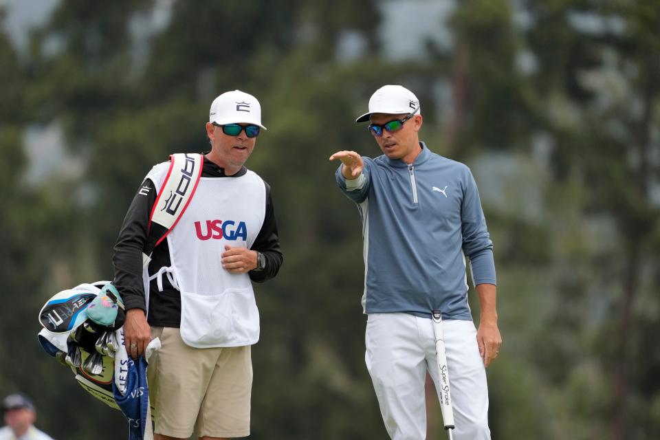 Rickie Fowler and his caddie, Ricky Romano, survey the green on the 15th hole Thursday during the first round of the U.S. Open at Los Angeles Country Club. Fowler and Xander Schauffele shot record-breaking 62s on the tournament's first day.