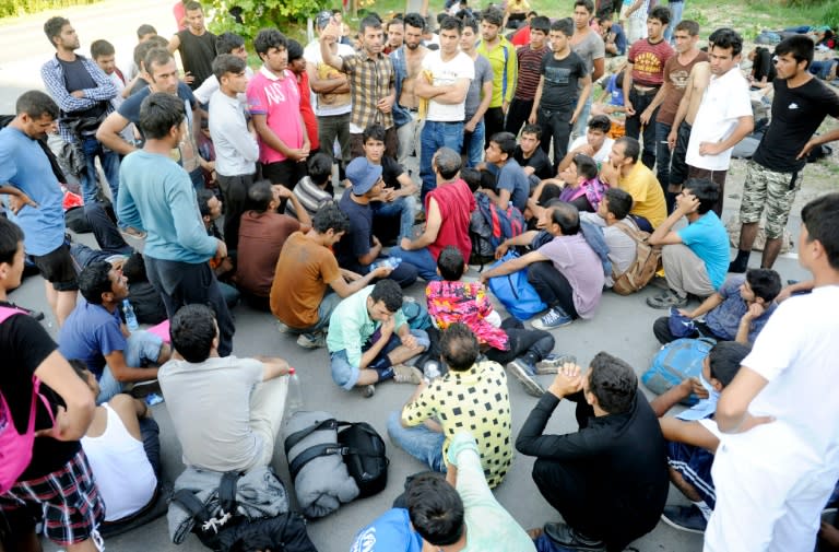 A group of migrants protest over the closed national border preventing them from entering central Europe in Belgrade on July 22, 2016