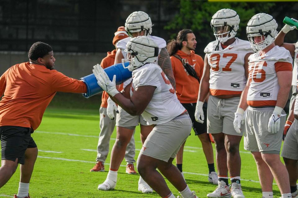 Texas defensive tackle Vernon Broughton goes through drills during the first practice of spring football Tuesday at Denius Fields. Broughton is one of several veterans expected to step into one of the starting roles left by T'Vondre Sweat and Byron Murphy II, who will both be picked in next month's NFL draft.