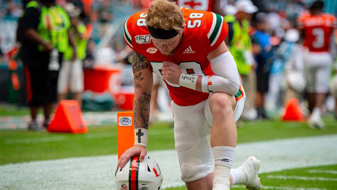 UM long snapper Clay James, a national semifinalist for the 2022 Wuerffel Trophy, kneels in prayer