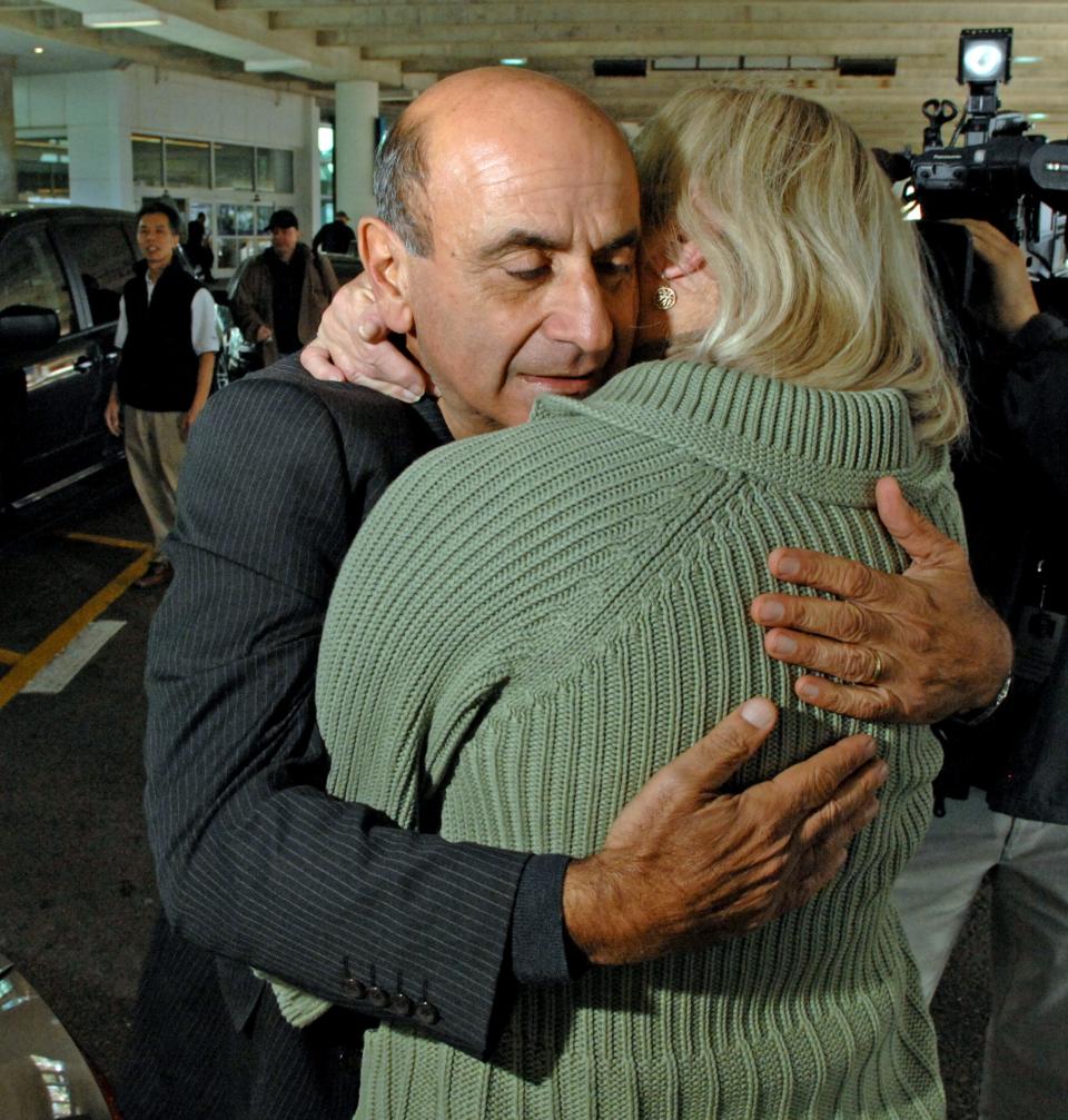 Carl Bazarian of Amelia Island hugs wife Linda after seeing her for the first time upon returning to Jacksonville from the Jan. 15, 2009, "Miracle on the Hudson" in Manhattan, N.Y. All 155 people aboard US Airways Flight 1549 survived after crash landing into the Hudson River shortly after departing LaGuardia Airport when the plane struck some geese disabling the engines.