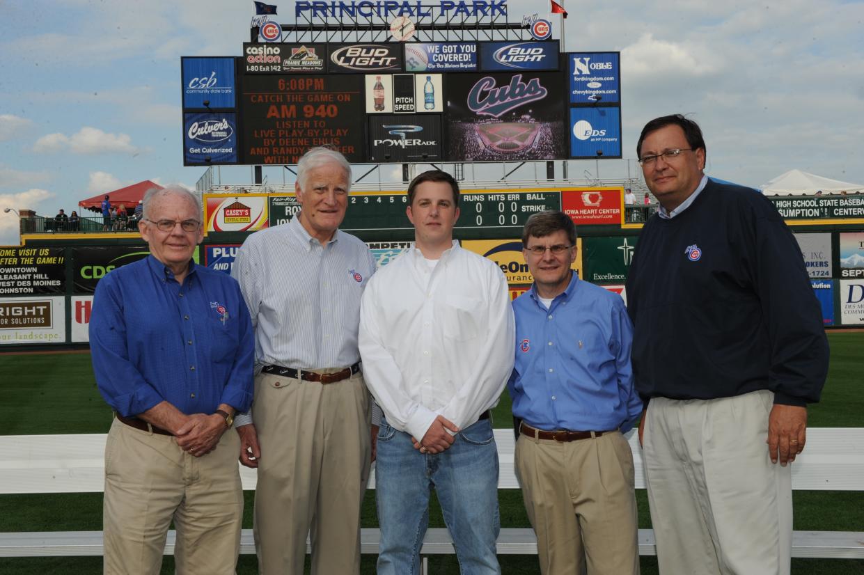 Michael Gartner and the rest of the Iowa Cubs ownership group pose before a recent game. (Photo credit: Iowa Cubs)