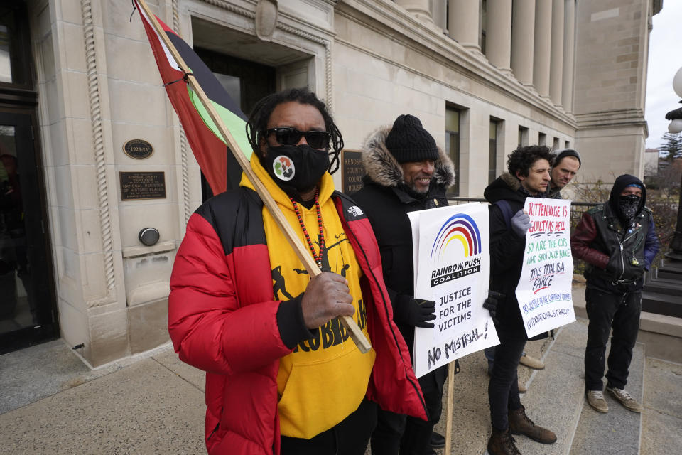 Justin Blake, left, uncle of Jacob Blake, stands outside the Kenosha County Courthouse, Thursday, Nov. 18, 2021 in Kenosha, Wis., during the Kyle Rittenhouse murder trial. Rittenhouse is accused of killing two people and wounding a third during a protest over police brutality in Kenosha, last year. (AP Photo/Paul Sancya)