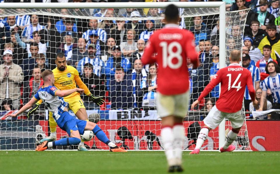 Brighton's Spanish goalkeeper Robert Sanchez saves a shot from Manchester United's Danish midfielder - GLYN KIRK/AFP via Getty Images