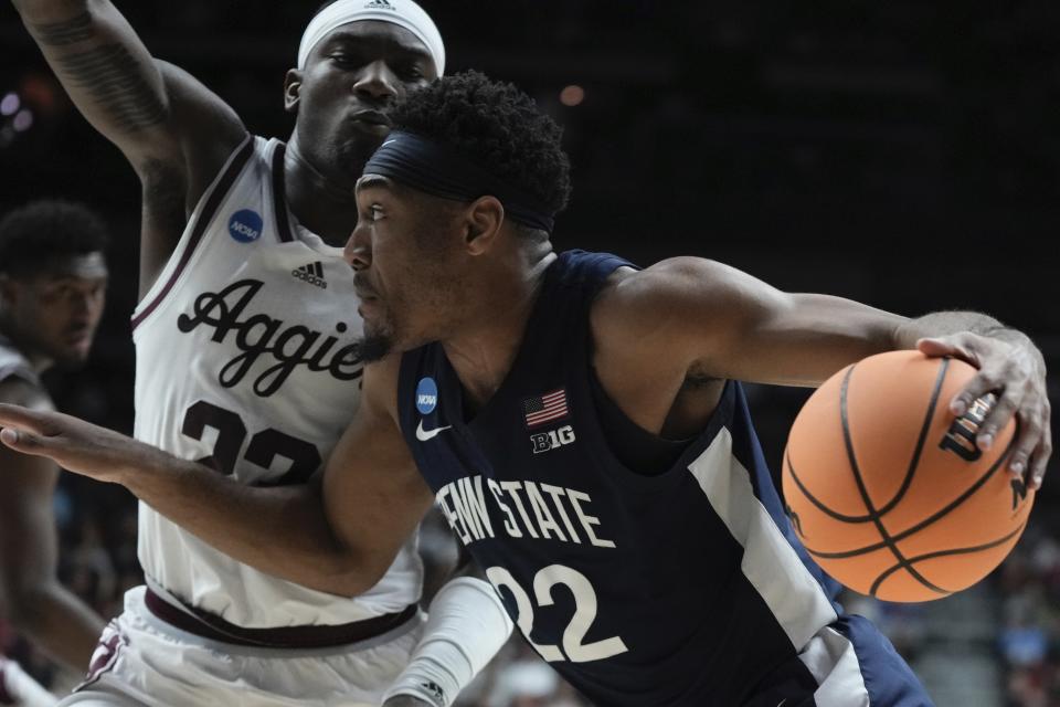 Penn State's Jalen Pickett drives by Texas A&M's Tyrece Radford during the first half of a first-round college basketball game in the NCAA Tournament Thursday, March 16, 2023, in Des Moines, Iowa. (AP Photo/Morry Gash)