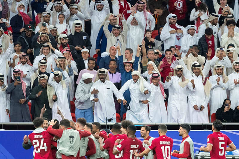 Qatar players celebrate a goal with fans during the AFC Asian Cup Semi Final soccer match between Qatar and Iran at Al Thumama Stadium. -/SPA/dpa