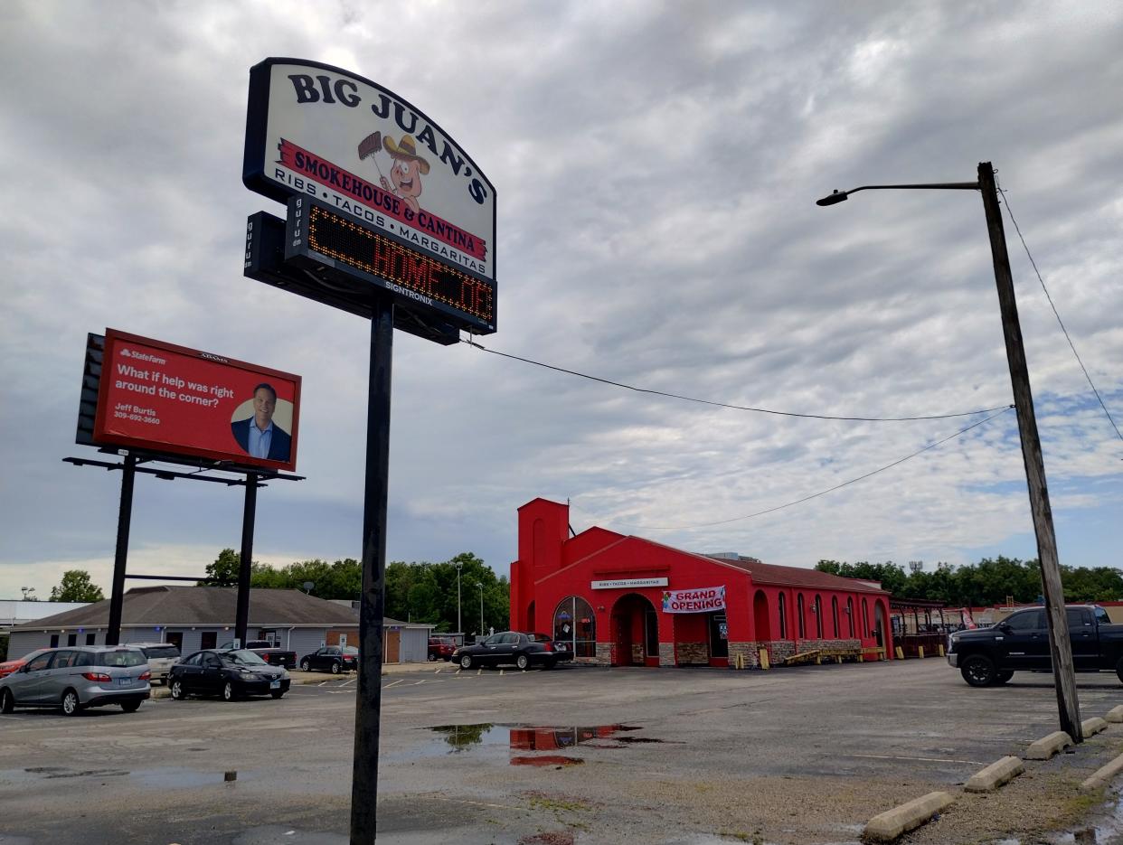 A sign sits outside of Big Juan's Texas Smokehouse & Baha Beach Club in Peoria. The business opened in June.