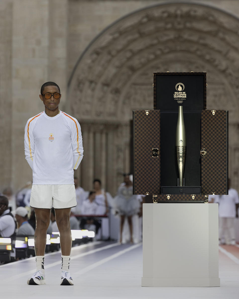 Pharrell Williams with the 2024 Paris Olympics torch trunk.