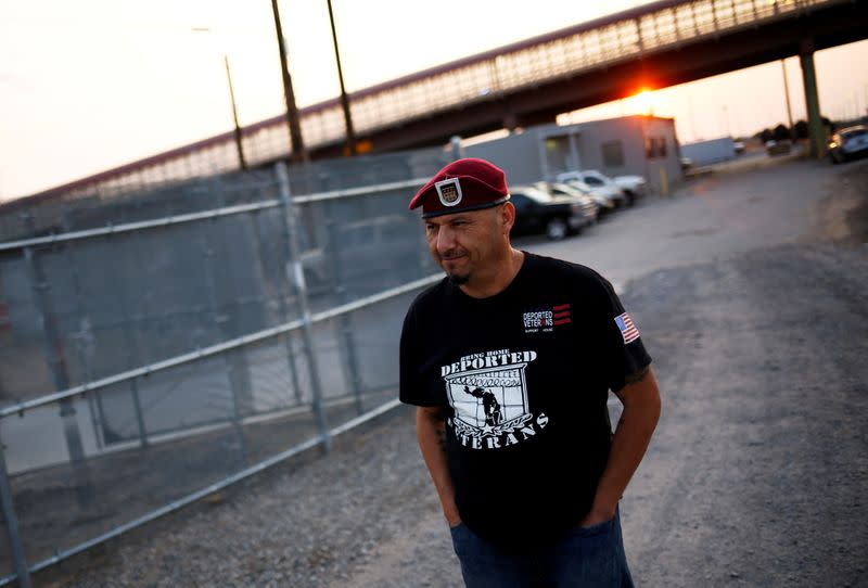 FILE PHOTO: Military veterans walk on the border between the U.S. and Mexico to request their return to the United States, in El Paso