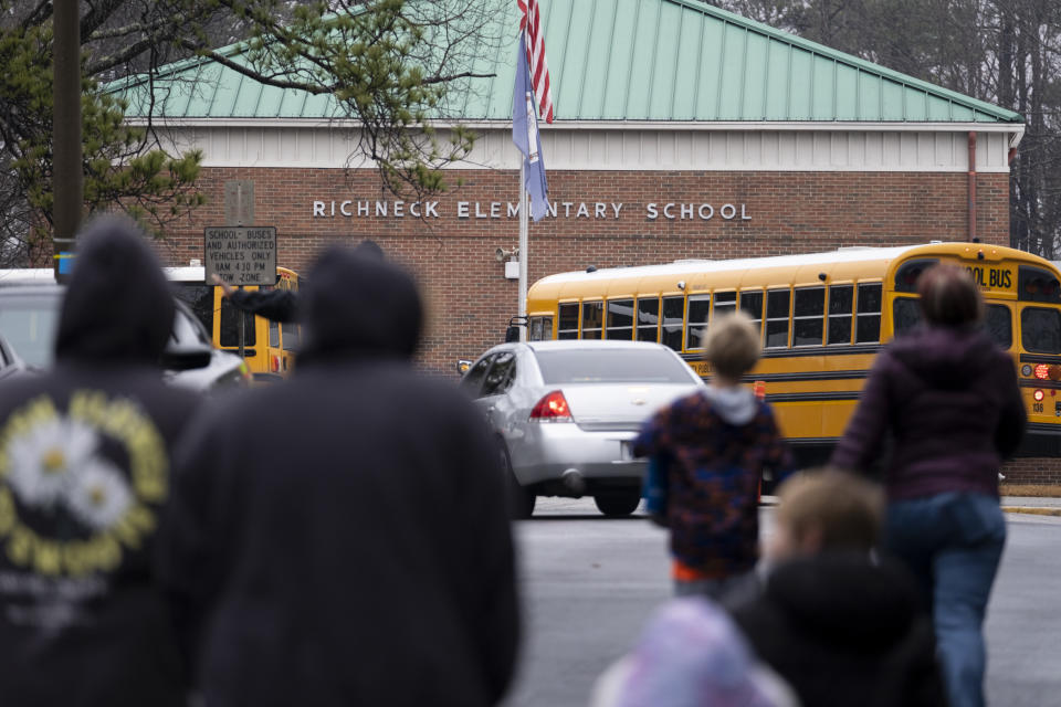 Students return to Richneck Elementary in Newport News, Va., on Monday, Jan. 30, 2023. The elementary school where a 6-year-old boy shot his teacher reopened Monday with stepped-up security and a new administrator, as nervous parents and students expressed optimism about a return to the classroom. (Billy Schuerman/The Virginian-Pilot via AP)