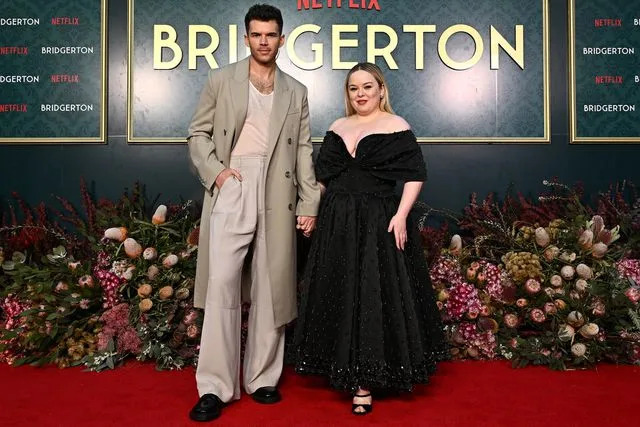 <p>James Gourley/Getty</p> Luke Newton and Nicola Coughlan attend the "Bridgerton" Season 3 launch