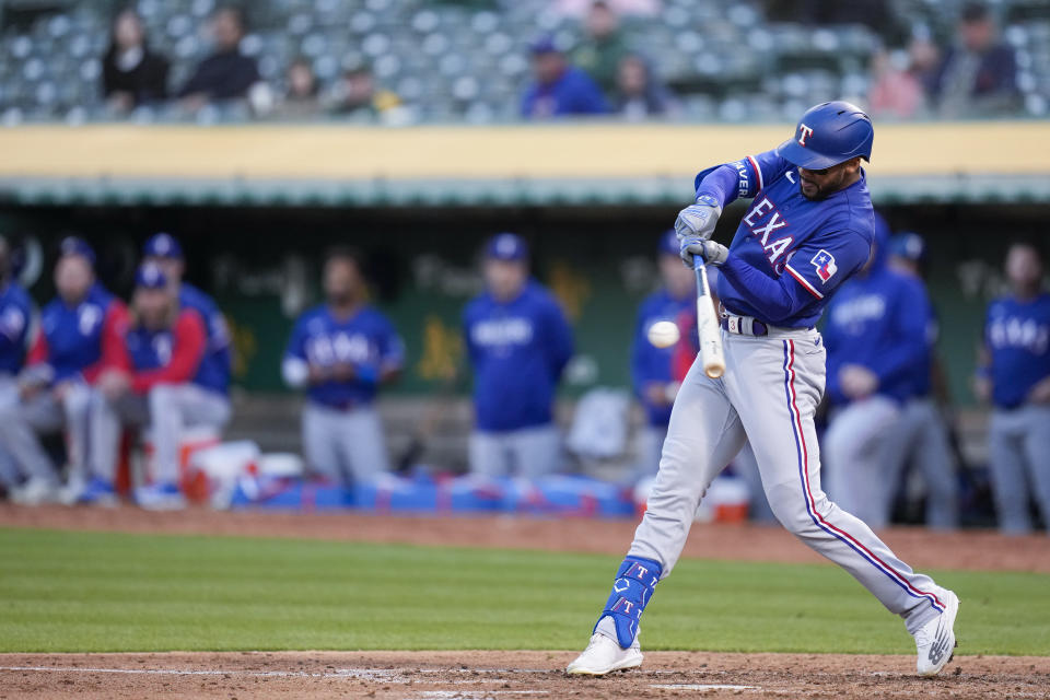 Texas Rangers' Leody Taveras hits an RBI single against the Oakland Athletics during the fifth inning of a baseball game in Oakland, Calif., Thursday, May 11, 2023. (AP Photo/Godofredo A. Vásquez)