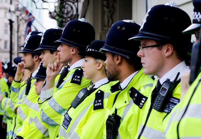 A line of uniformed police officers.