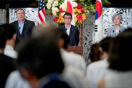 Secretary of State Mike Pompeo, left, accompanied by Japan's Foreign Minister Taro Kono, center, and South Korea's Foreign Minister Kang Kyung Wha, right, speaks at a news conference at the Iikura Guest House in Tokyo, Japan, Sunday, July 8, 2018. Andrew Harnik/Pool via Reuters