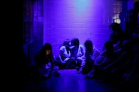 Two girls kiss before a performance, during "The Queer Archive Festival" in Athens