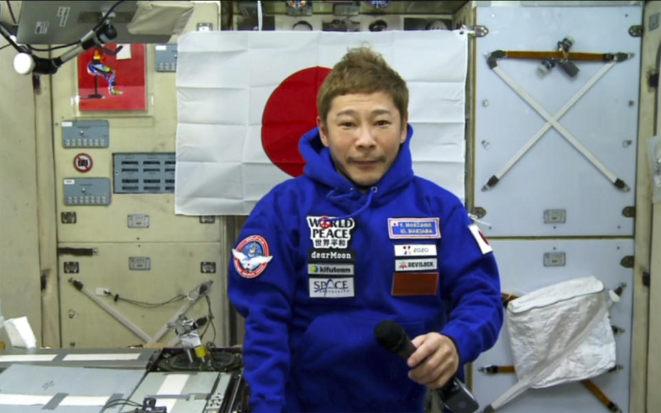 Japanese space tourist Yusaku Maezawa speaks during an interview with The Associated Press from the International Space Station, ISS, Monday, Dec. 13, 2021. Maezawa said he experienced motion sickness after arriving at the space outpost and it took him a few days to adapt to zero gravity. (Roscosmos Space Agency via AP)