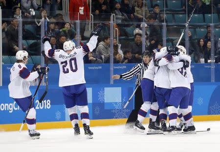 Ice Hockey - Pyeongchang 2018 Winter Olympics - Men's Playoff Match - Slovenia v Norway - Gangneung Hockey Centre, Gangneung, South Korea - February 20, 2018 - Players of Norway's team celebrate after Alexander Bonsaksen scored a goal in overtime to defeat Slovenia. REUTERS/Kim Kyung-Hoon