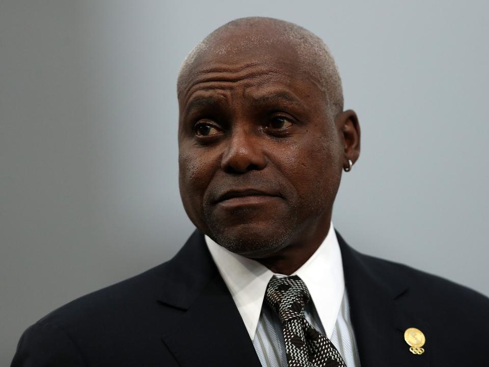 Carl Lewis today in a suit and tie