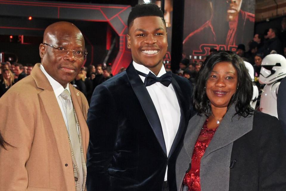 John Boyega with his parents, Samson (left) and Abigail Boyega (right) | David M. Benett/WireImage