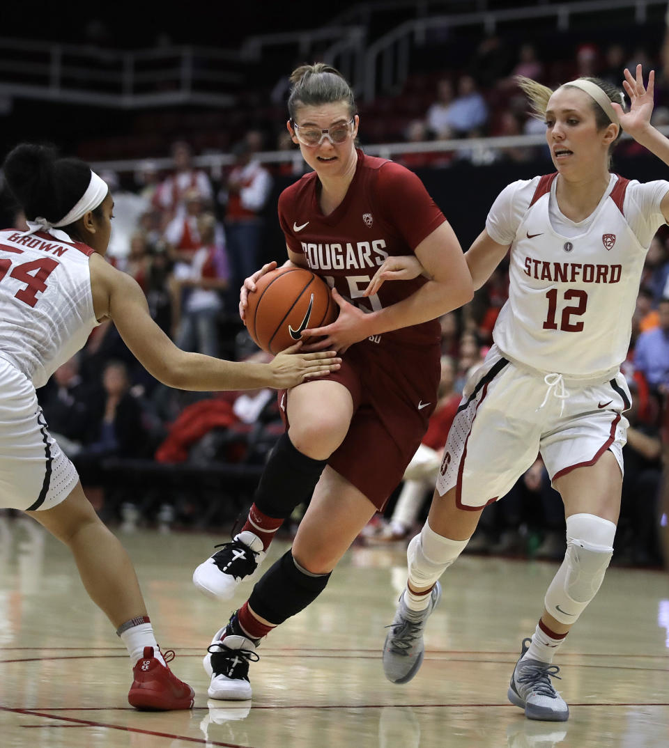 Washington State forward Borislava Hristova, center, drives the ball between Stanford's Jenna Brown, left, and Lexie Hull (12) during the first half of an NCAA college basketball game Sunday, Jan. 20, 2019, in Stanford, Calif. (AP Photo/Ben Margot)
