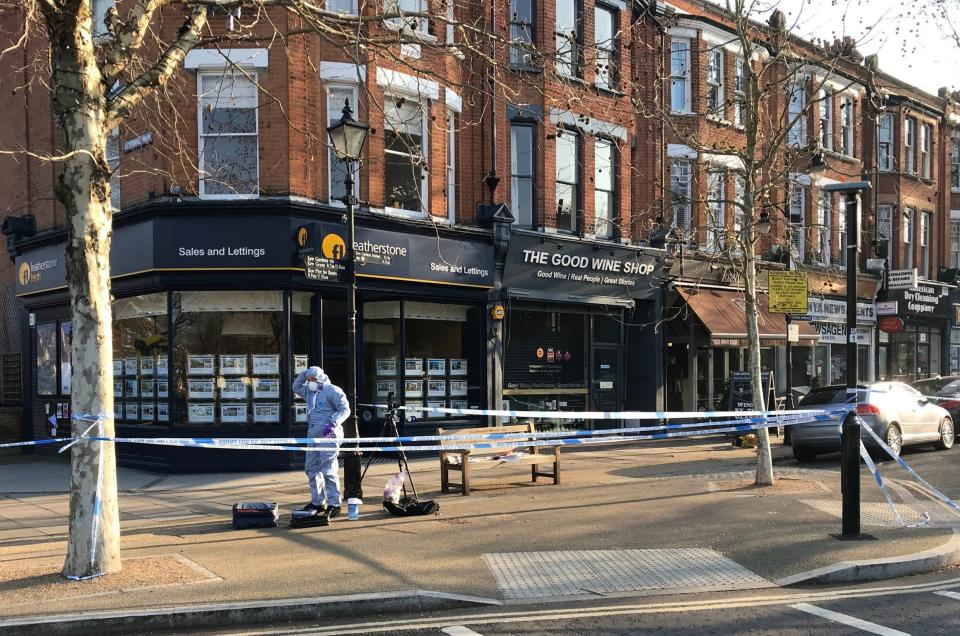 Forensic investigators at the scene where a man was stabbed at Royal Parade, close to the world famous Kew Gardens. (PA)