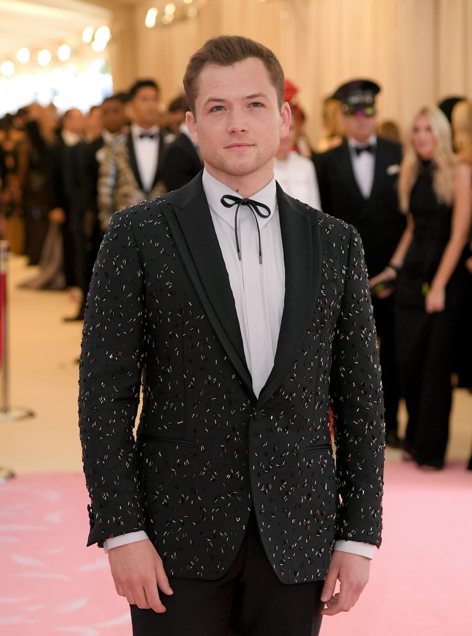 <h1 class="title">Taron Egerton in Salvatore Ferragamo</h1><cite class="credit">Photo: Getty Images</cite>