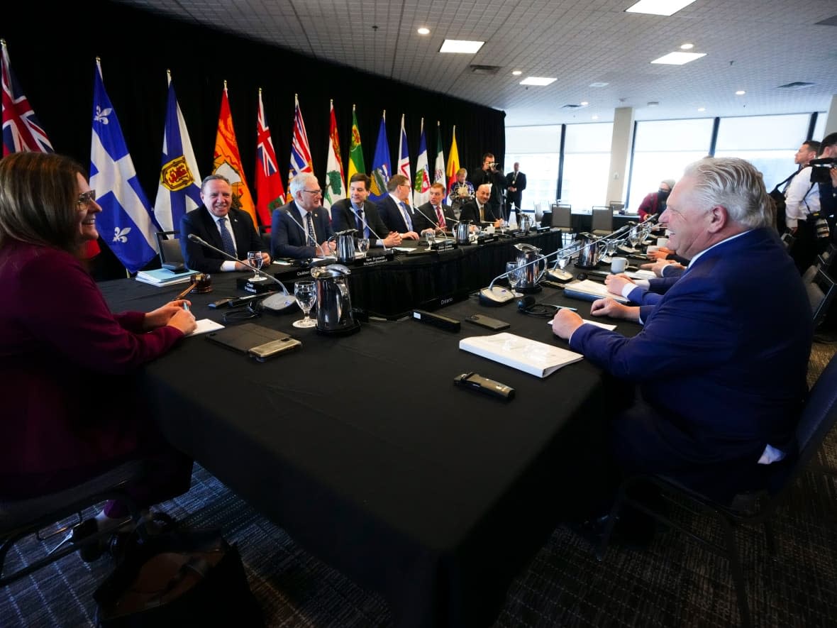 Manitoba Premier Heather Stefanson, left, talks to Quebec Premier Francois Legault, back left, and Ontario Premier Doug Ford, right, as she chairs a meeting with Canada's premiers in Ottawa on Tuesday, Feb. 7, 2023 in Ottawa. (Sean Kilpatrick/The Canadian Press - image credit)