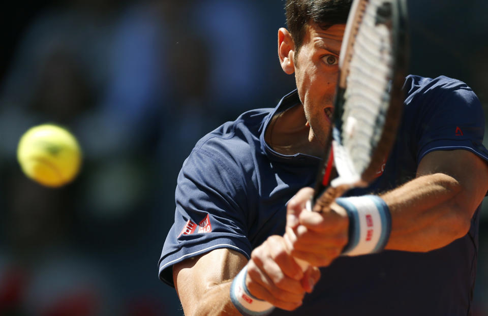 <p>Novak Djokovic hits a return to Rafael Nadal during their mens semifinal tennis match at the Madrid Open tennis tournament in Madrid, Spain, May 13, 2017. (Photo: Francisco Seco/AP) </p>