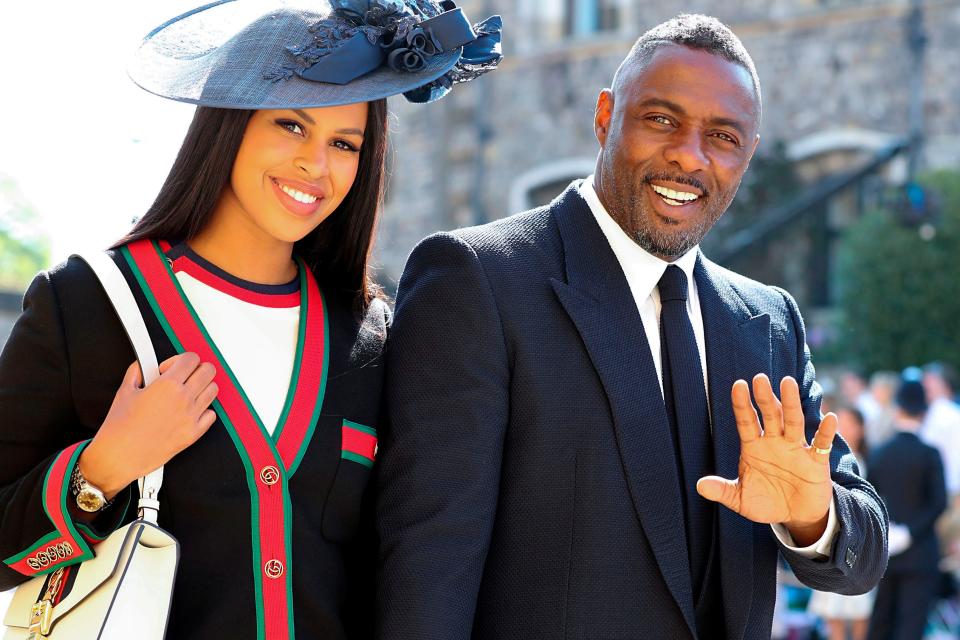 British actor Idris Elba (R) arrives with his fiancee Sabrina Dhowre (L) for the wedding ceremony of Prince Harry and Meghan Markle at St George's Chapel, Windsor Castle, in Windsor, on May 19, 2018.