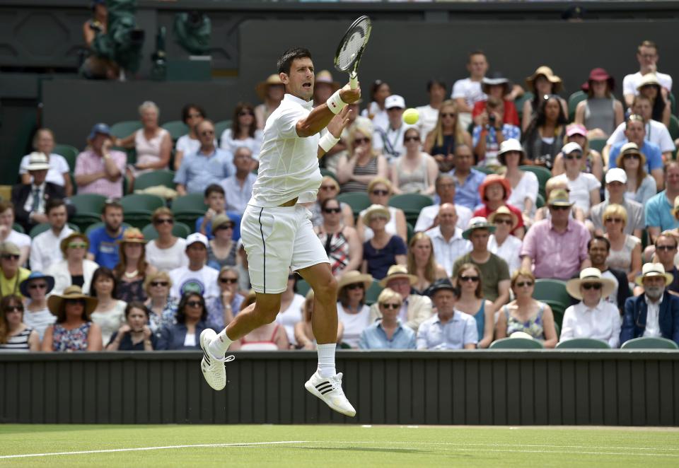 Novak Djokovic of Serbia jumps for a shot during his match against Jarkko Nieminen of Finland at the Wimbledon Tennis Championships in London, July 1, 2015. REUTERS/Toby Melville