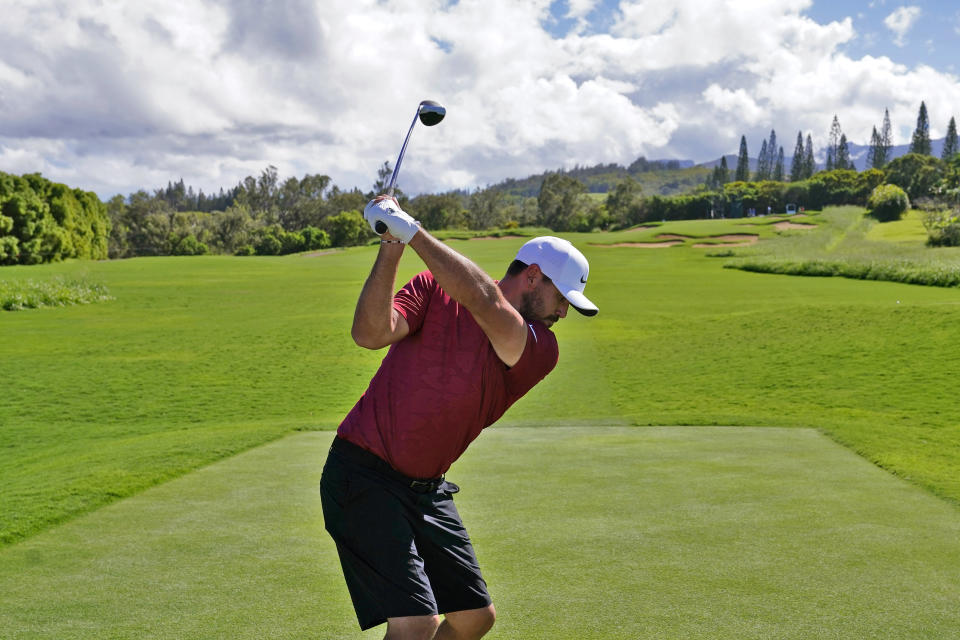 Brooks Koepka hits from the 14th tee during the Tournament of Champions pro-am team play golf event, Wednesday, Jan. 5, 2022, at Kapalua Plantation Course in Kapalua, Hawaii. (AP Photo/Matt York)