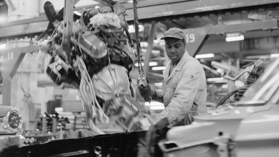 A black auto worker installs engines into Ford automobiles at the Ford Motor Company Willow Run plant in Detroit, Michigan, at a time in 1963 when African Americans rarely held such positions.  - Bettmann/Getty Images