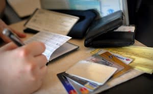 Credit cards on a table. next to a bank book