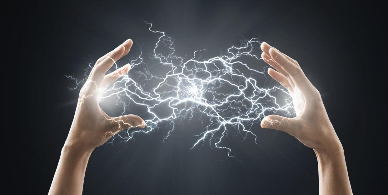 electric energy sparks from a hand