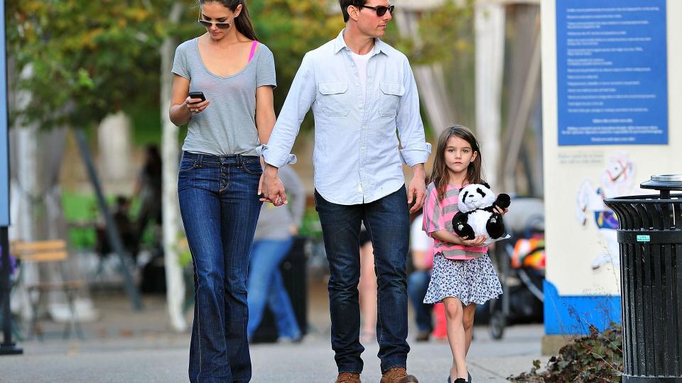 Tom holding hands with ex-wife katie holmes and daughter Suri 