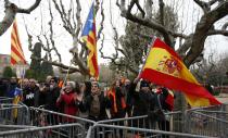 Protestors for and against independence shout slogans and wave Spanish and Catalan flags in front of Catalonia's regional parliament as lawmakers voted inside, in Barcelona, January 16, 2014. Local lawmakers in the northeastern Spanish region of Catalonia voted to seek a referendum on breaking away from Spain on Thursday, setting themselves up for a battle with an implacably opposed central government in Madrid. The Catalan Parliament in Barcelona voted 87 to 43, with 3 abstentions, to send a petition to the national parliament seeking the power to call a popular vote on the region's future. The independence movement in Catalonia, which has its own language and represents a fifth of Spain's national economy, is a direct challenge to Prime Minister Mariano Rajoy, who has pledged to block a referendum on constitutional grounds. REUTERS/Albert Gea (SPAIN - Tags: POLITICS CIVIL UNREST)