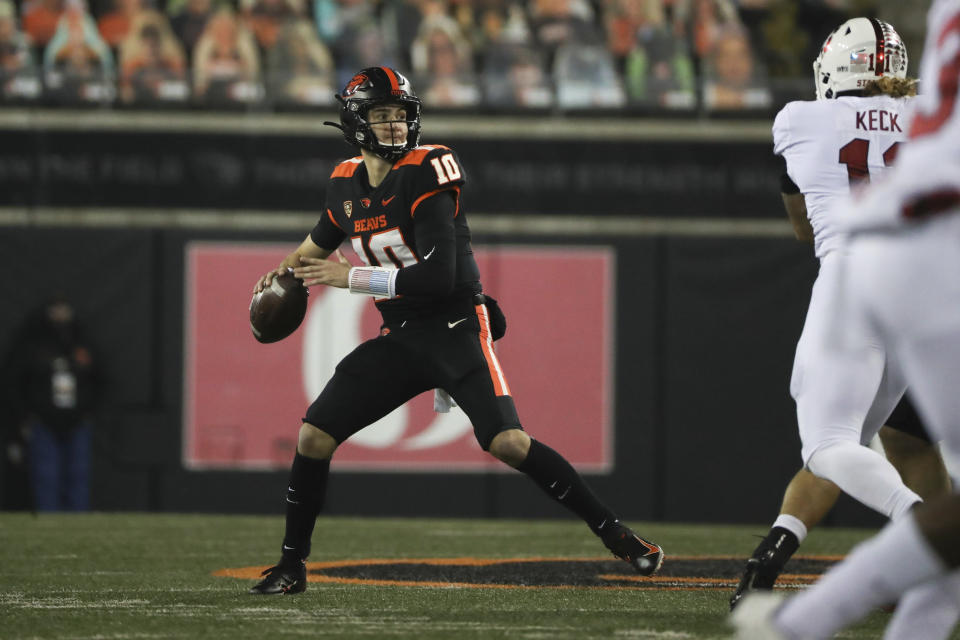 Oregon State quarterback Chance Nolan (10) looks for a receiver during the first half of the team's NCAA college football game against Stanford in Corvallis, Ore., Saturday, Dec. 12, 2020. (AP Photo/Amanda Loman)