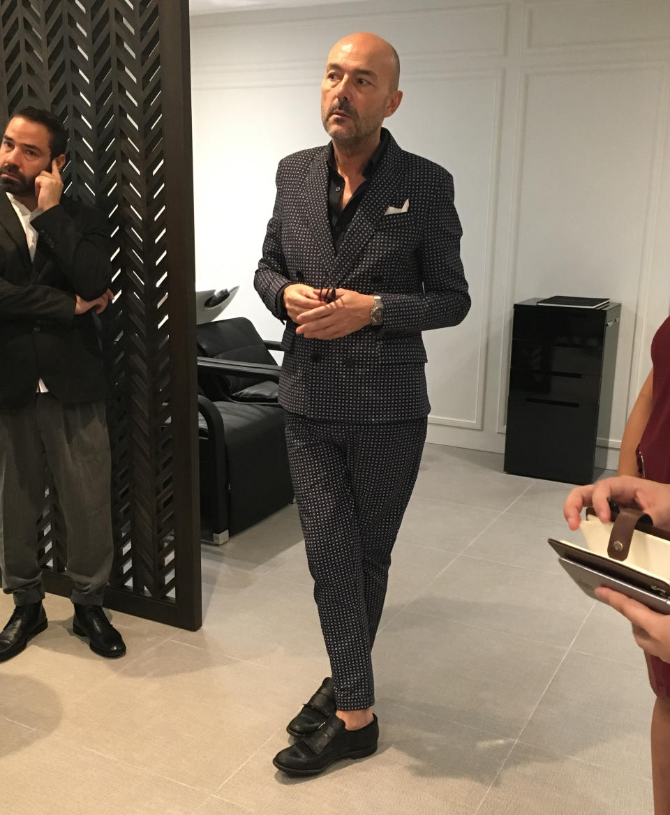 Rossano Ferretti, 57, in a bespoke suit at the media preview of the Rossano Ferretti hair salon at the Fullerton Hotel. Photo: Nurul Azliah/Yahoo Lifestyle Singapore