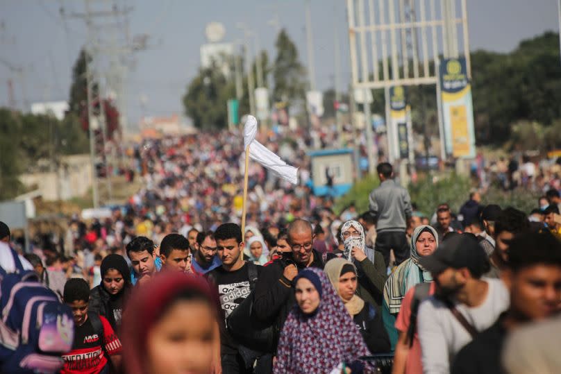 Palestinian citizens displaced from Gaza City to the southern Gaza Strip on Salah al-Din Street in the Al-Mughraqa area